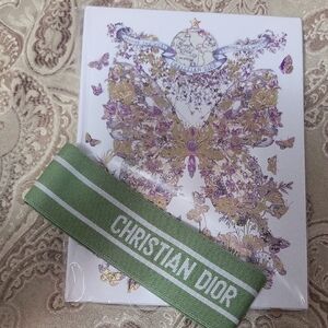 Christian Dior Floral notebook with intricate floral design.
